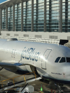 a jet plane parked in front of a building