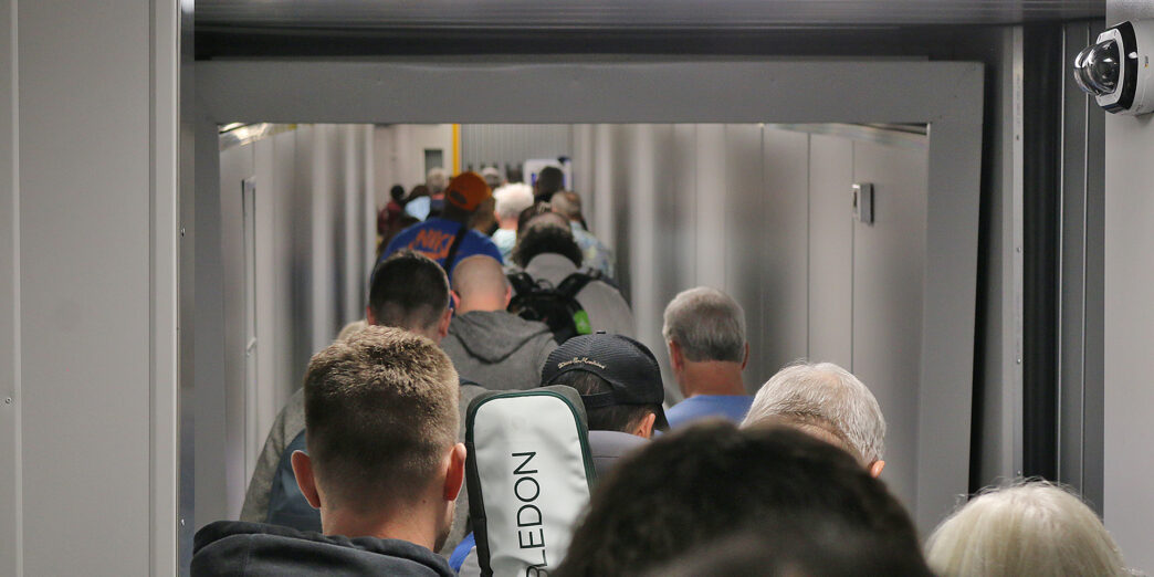 a group of people walking down a hallway
