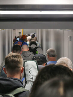 a group of people walking down a hallway