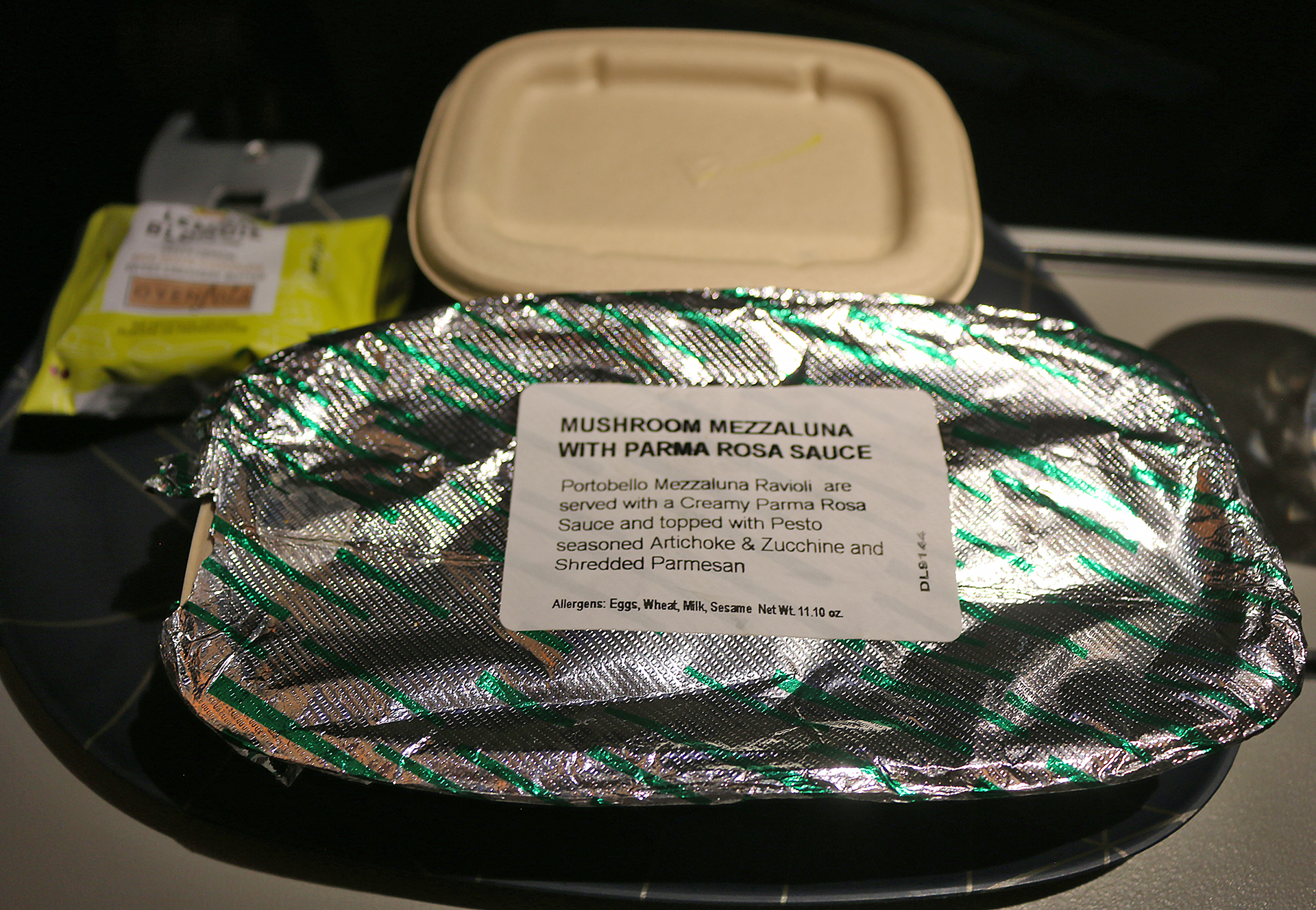 a foil wrapped food on a plate