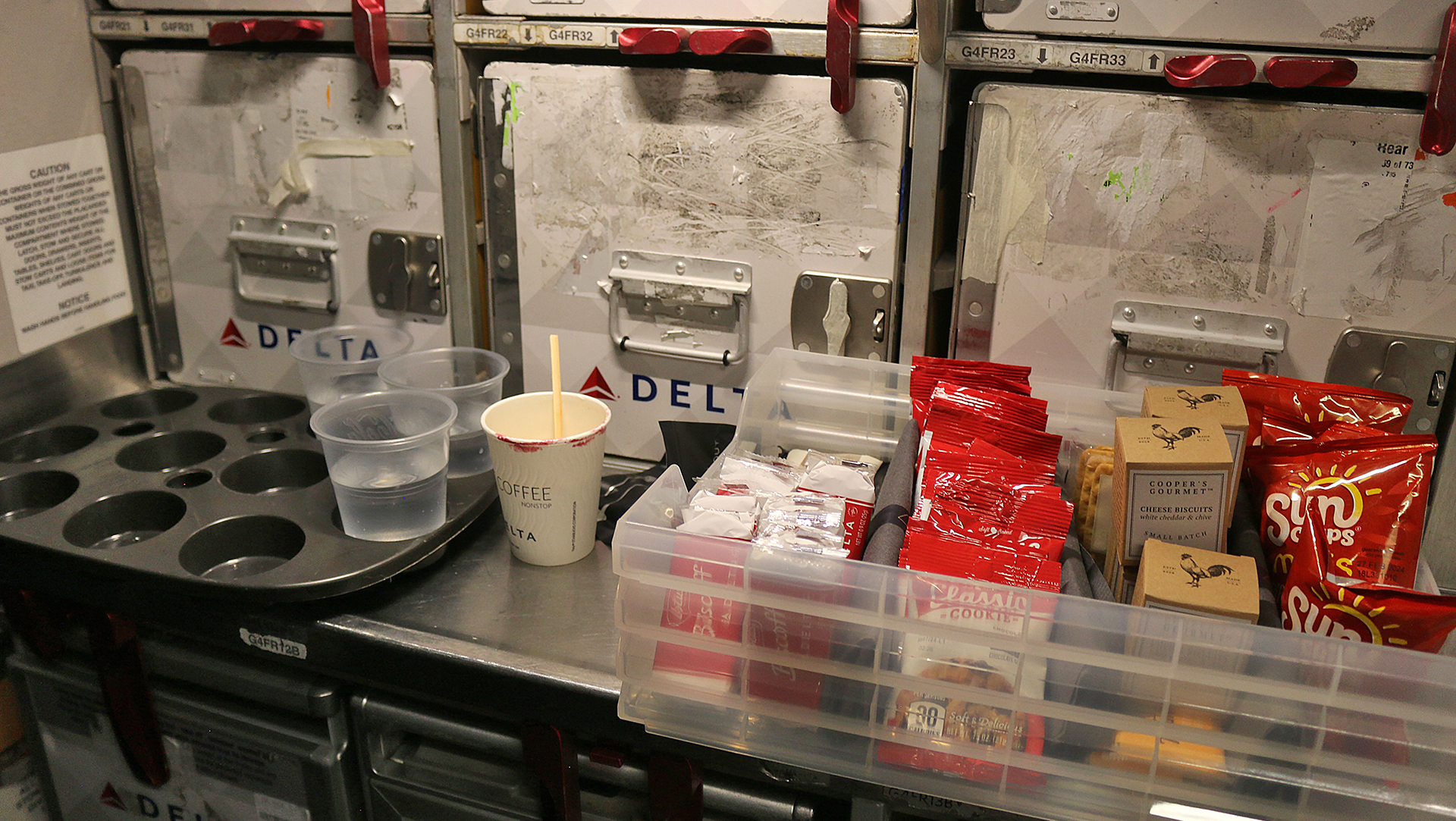 a tray of food and plastic containers on a counter