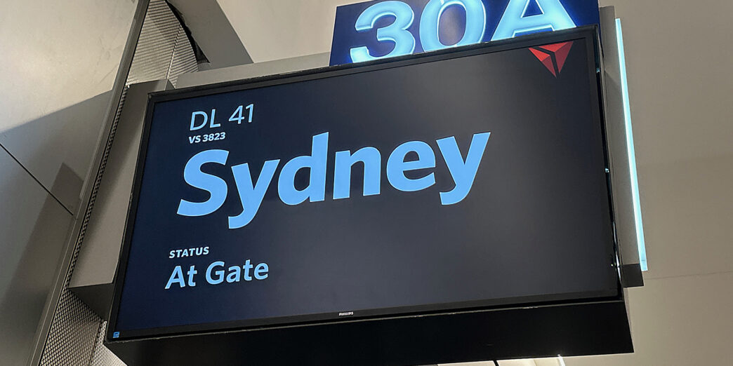 a sign with a blue and white text