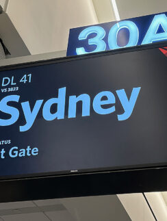 a sign with a blue and white text