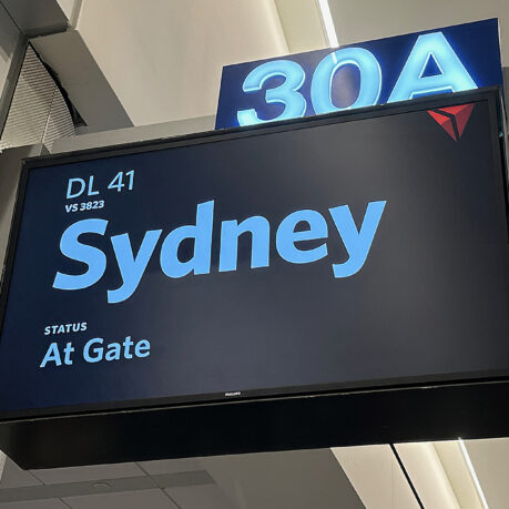 a sign with a blue and white text