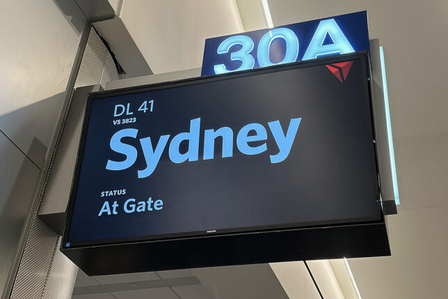 a sign with a blue and white text