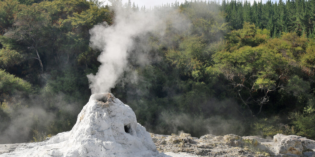 a mountain with a steam coming out of it