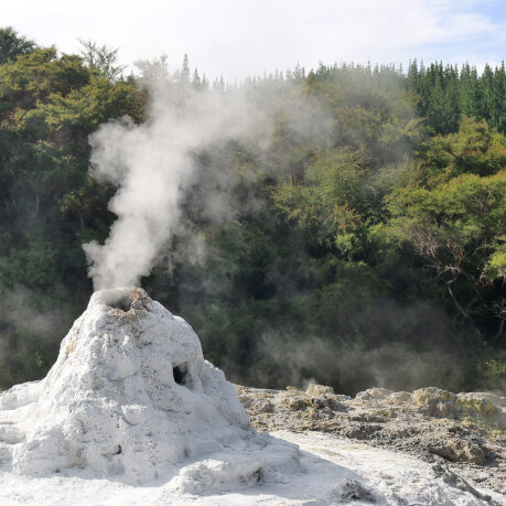 a mountain with a steam coming out of it