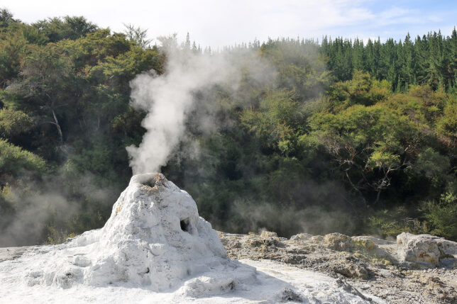 a mountain with a steam coming out of it