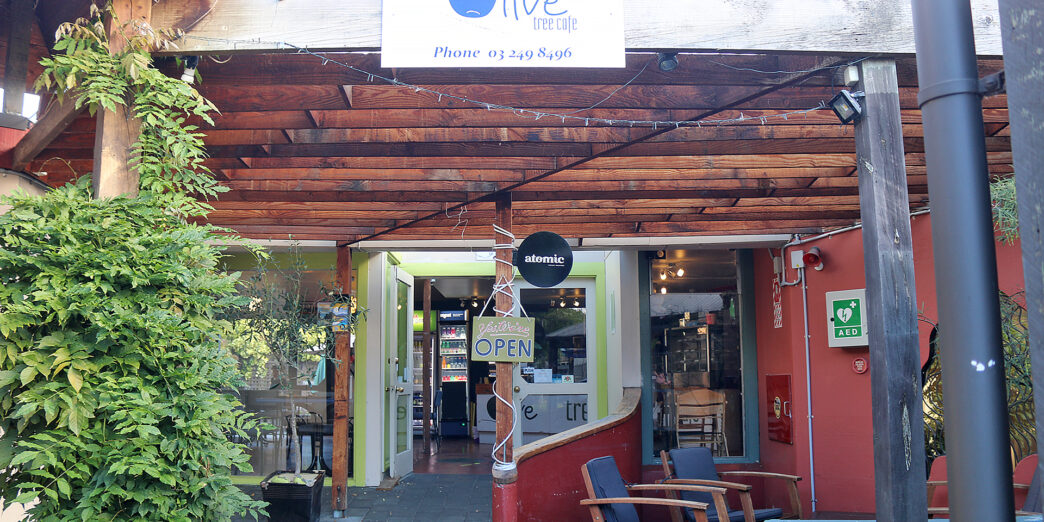 a restaurant with a sign