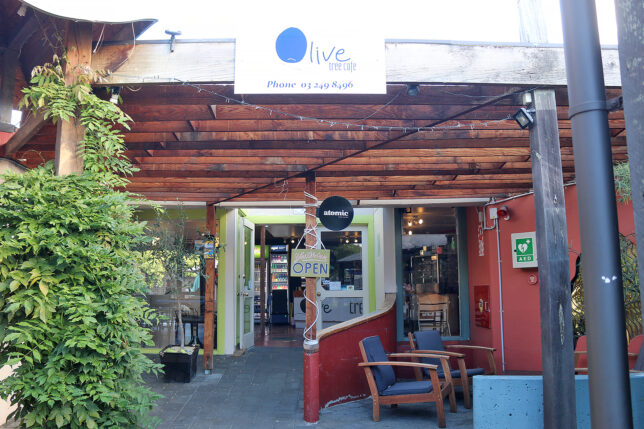 a restaurant with a sign