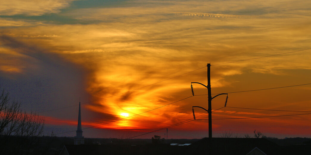 a sunset over a city