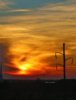 a sunset over a city