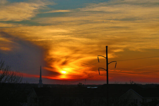 a sunset over a city