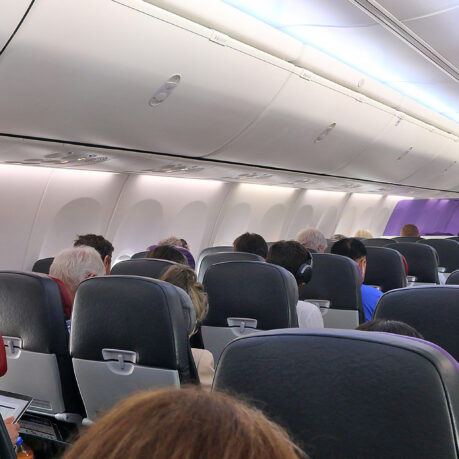 a group of people sitting in an airplane
