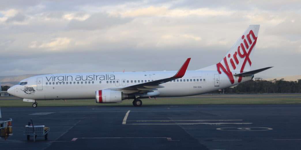 a white airplane on a runway