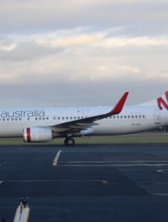 a white airplane on a runway