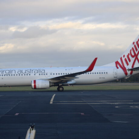 a white airplane on a runway