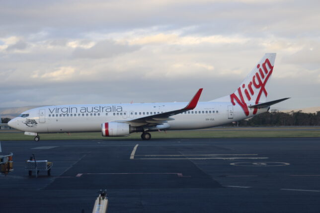 a white airplane on a runway