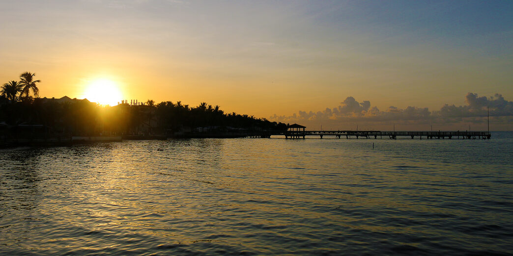 a sunset over a body of water