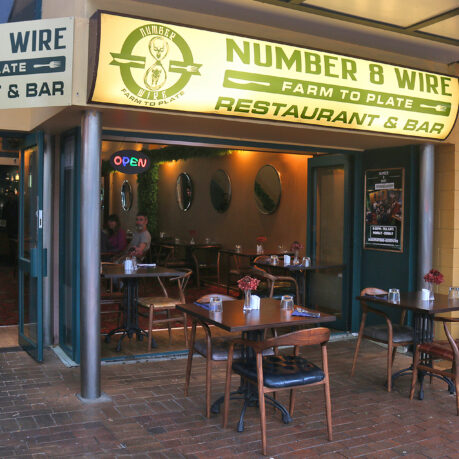 a restaurant with tables and chairs