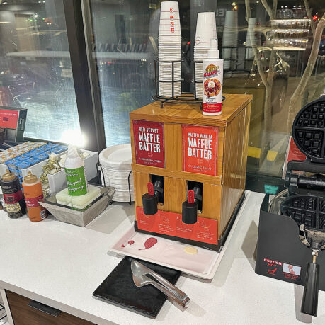 a machine with cups on top of it