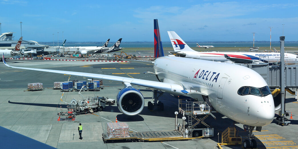 a group of airplanes at an airport