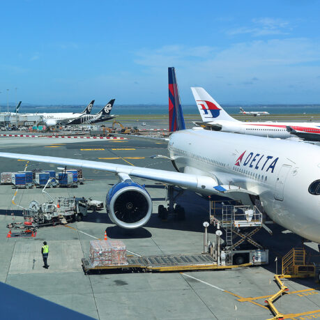 a group of airplanes at an airport