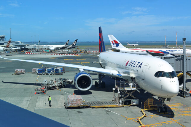 a group of airplanes at an airport