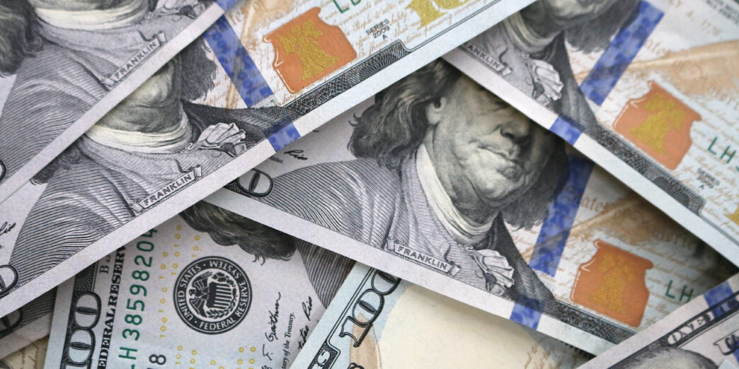 a pile of money with a face on it