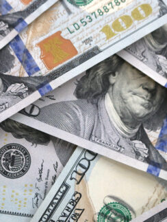 a pile of money with a face on it