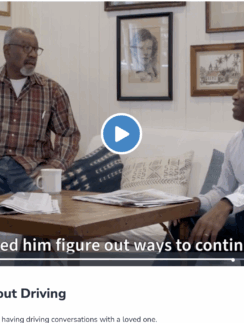 two men sitting on a couch