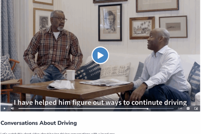 two men sitting on a couch