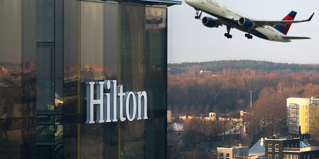 a plane flying over a building