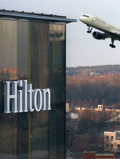 a plane flying over a building
