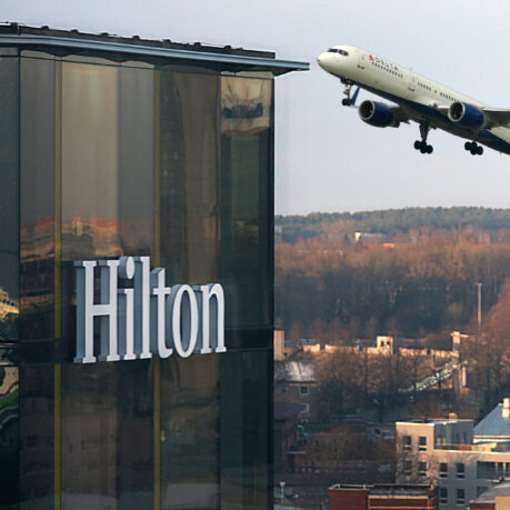 a plane flying over a building