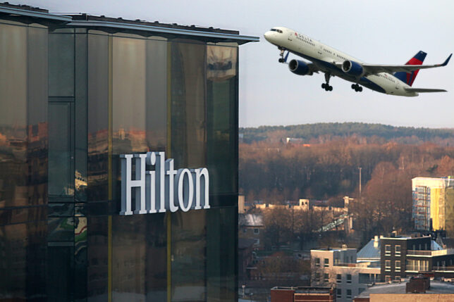 a plane flying over a building