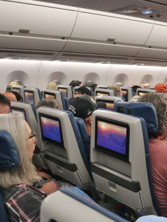 a group of people sitting in an airplane