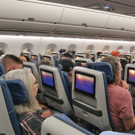 a group of people sitting in an airplane