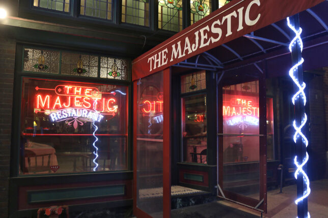 a restaurant entrance with a glass door