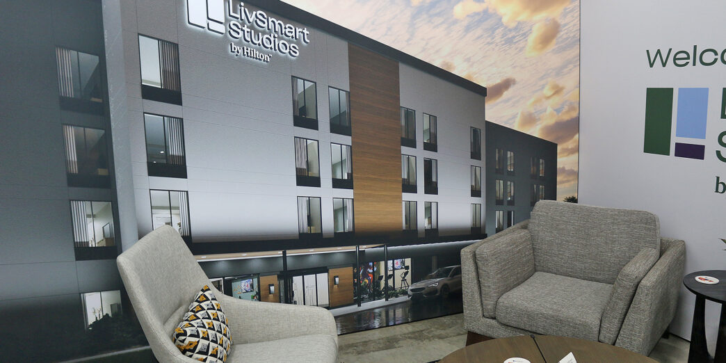 a room with a large wall with a picture of a building