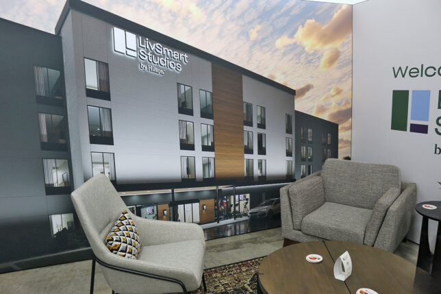 a room with a large wall with a picture of a building