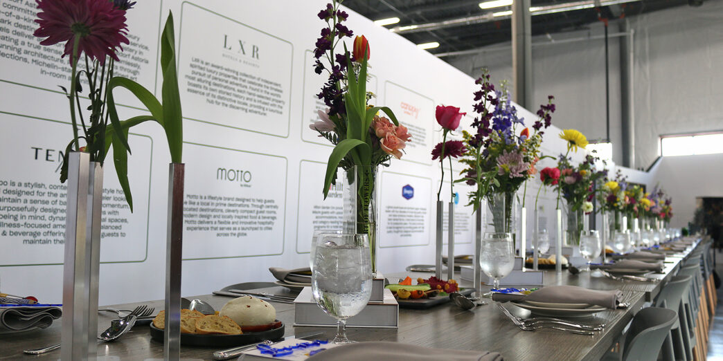 a table with flowers and plates
