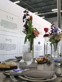a table with flowers and plates