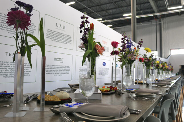 a table with flowers and plates