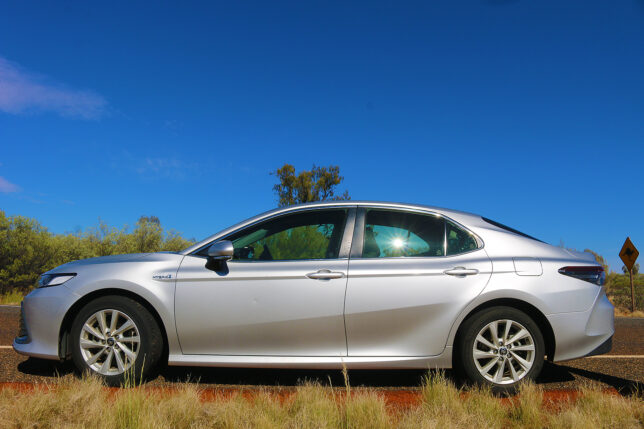 a silver car parked in a field