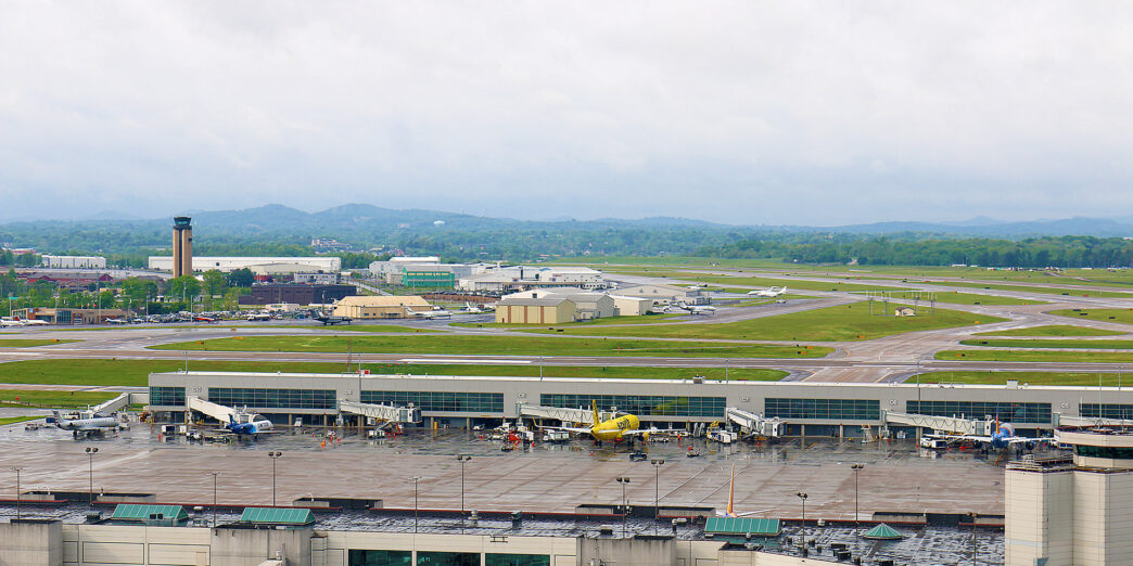 an airport with many buildings and a large parking lot