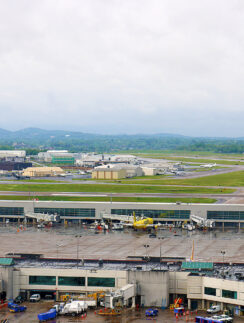 an airport with many buildings and a large parking lot