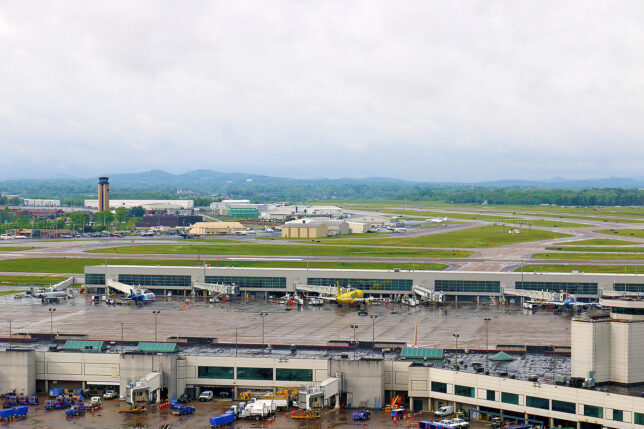 an airport with many buildings and a large parking lot