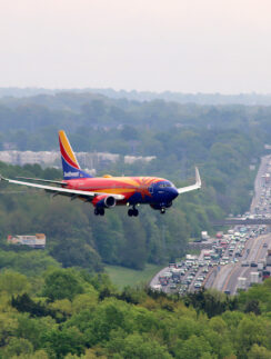 an airplane flying over a highway