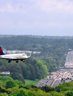 an airplane flying over a highway